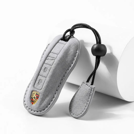 Dark Gray suede key fob case with Porsche logo on a white background