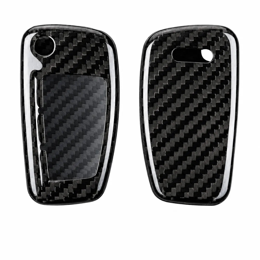Two glossy carbon fiber car key fob case covers shown side by side on a plain white background, with one cover displaying the front face and the other the back face.