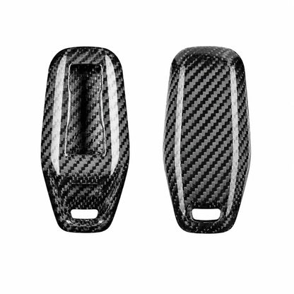 Two silver black carbon fiber textured protective covers with a glossy finish, displayed side-by-side on a solid white background.