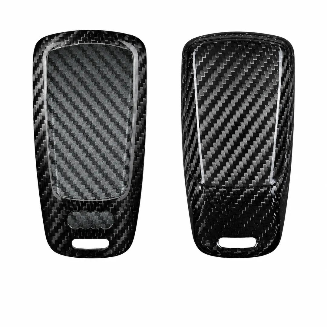 Two black carbon fiber key fob covers shown from the front and back on a plain white background.