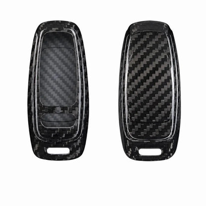 Two black carbon fiber textured key fob covers shown side by side on a plain white background.