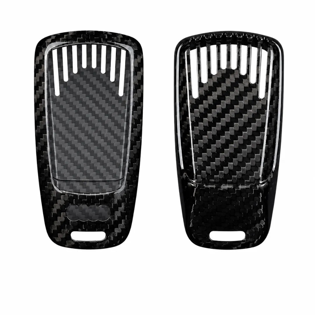 Two black carbon fiber textured key fob covers shown side by side on a plain white background.