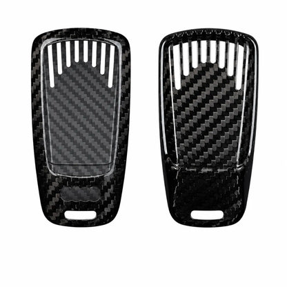 Two black carbon fiber textured key fob covers shown side by side on a plain white background.