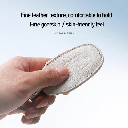 A hand holds a small oval leather pad or cover against a light blue gradient background, with text above describing fine leather texture and a skin-friendly feel.