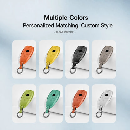 A promotional graphic showing eight personalized car key fob covers in different colors, arranged in a grid with text at the top reading 'Multiple Colors' and 'Personalized Matching, Custom Style'. The covers are shown in orange, yellow, black, taupe, lime green, mint green, and white, each with a metal key ring.