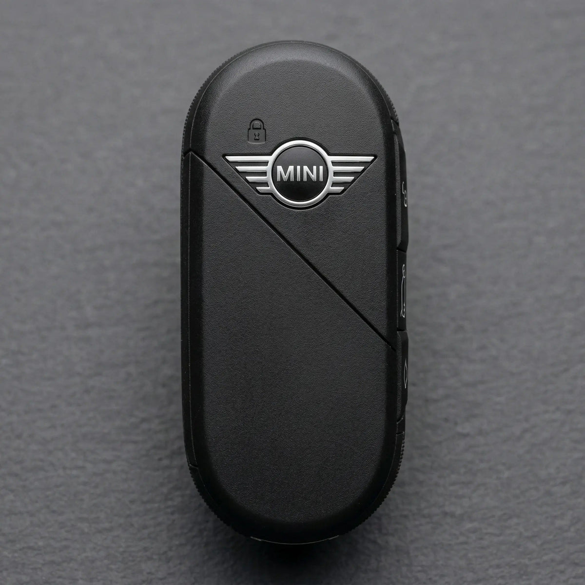 Schwarzer ovaler Mini Cooper Smart Key, Originalschlüssel mit silbernem Logo und Seitentasten