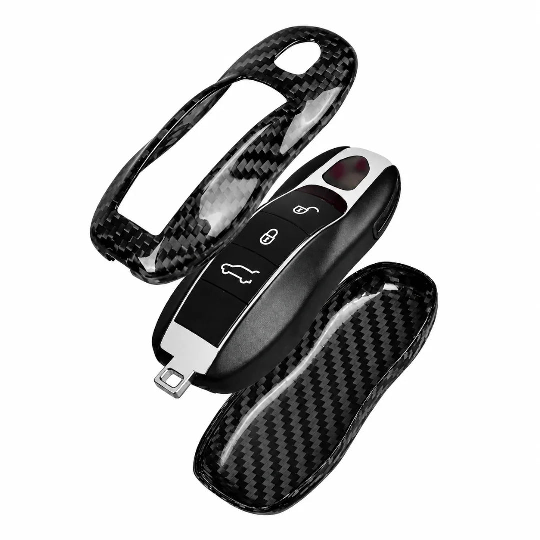 A carbon fiber patterned car key fob cover set, shown with a main cover fitted on a key fob and two separate matching covers on a plain white background.