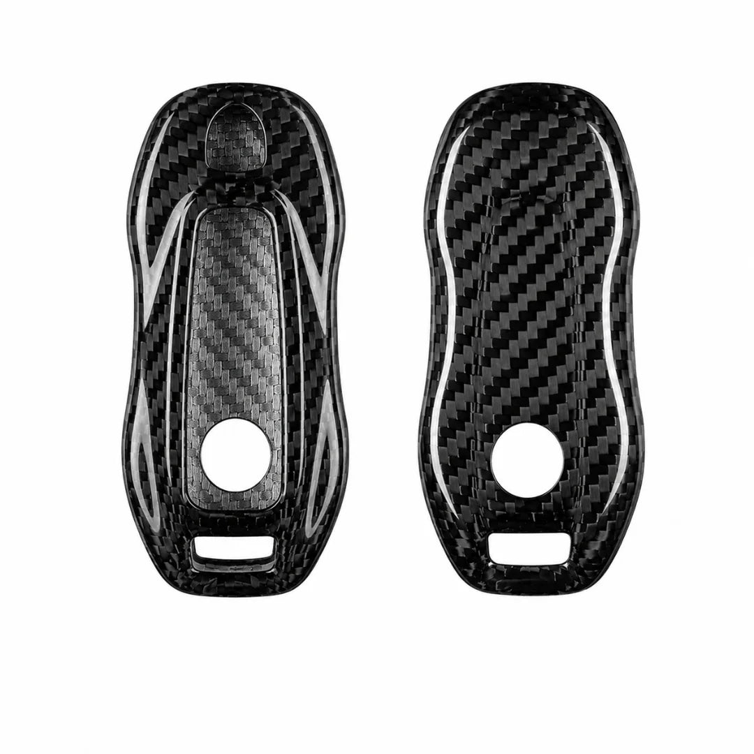 Two black carbon fiber key fob covers with a glossy woven pattern, shown from front and back views on a white background.