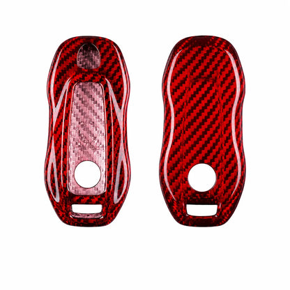 Two glossy red carbon fiber key fob covers with a woven carbon pattern, shown side by side on a plain white background.