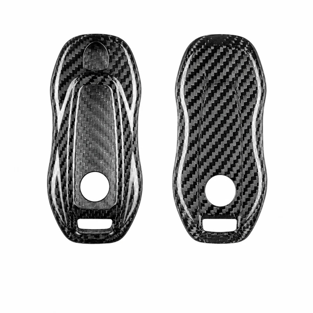 Two black carbon fiber textured key fob covers shown side by side on a plain white background.