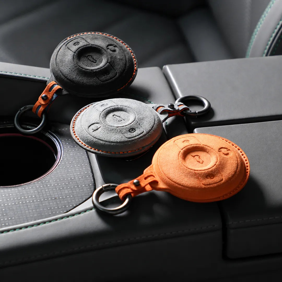Three Smart Alcantara Key Covers On Console