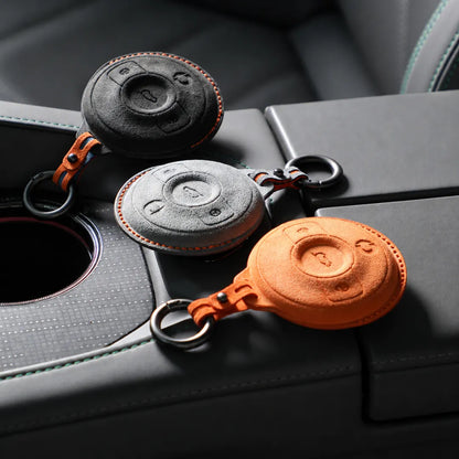 Three Smart Alcantara Key Covers On Console